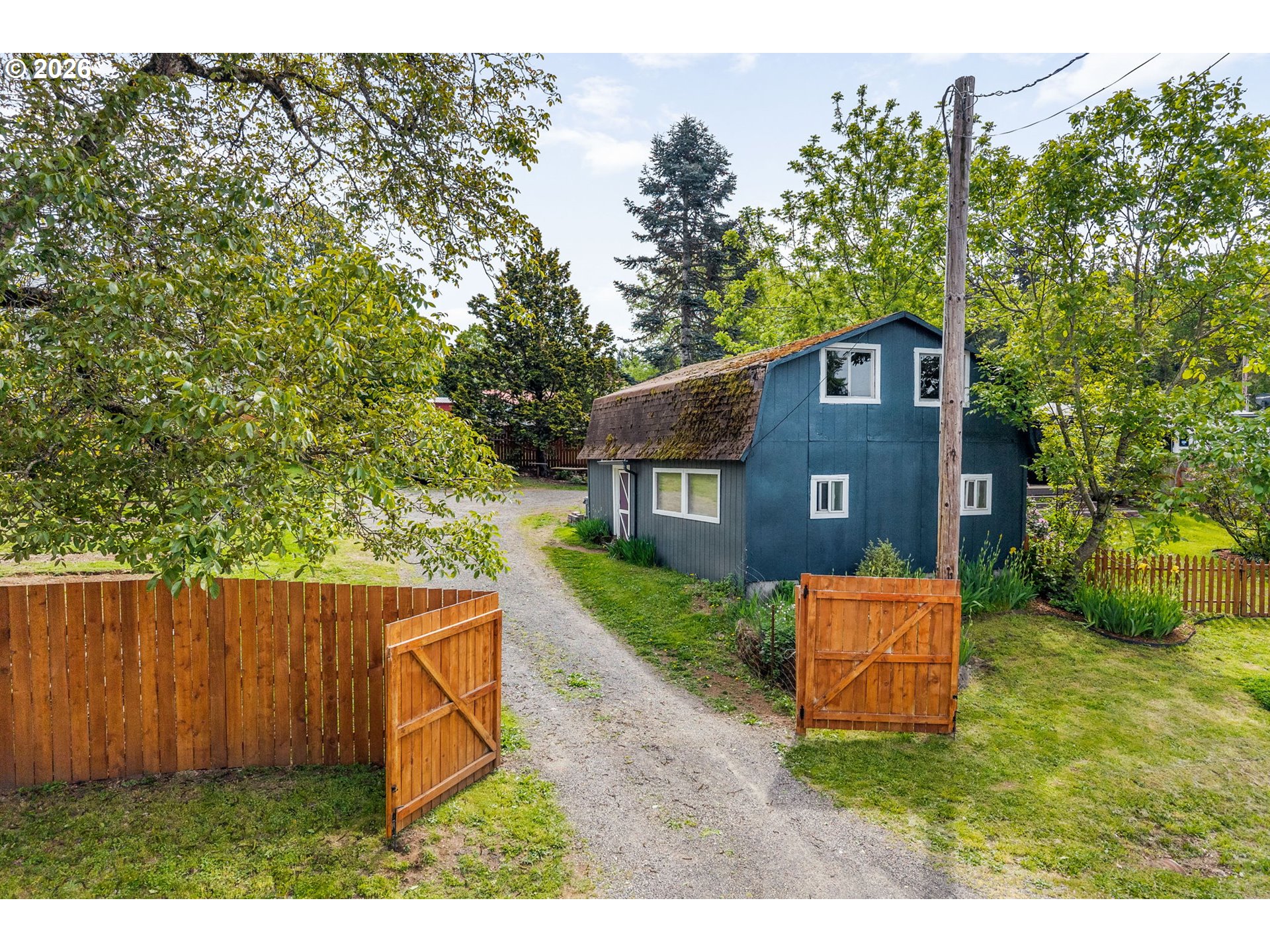 11 2nd Street Carson, WA 98610 - Photo 27 of 40 a house view with a wooden fence and a bench