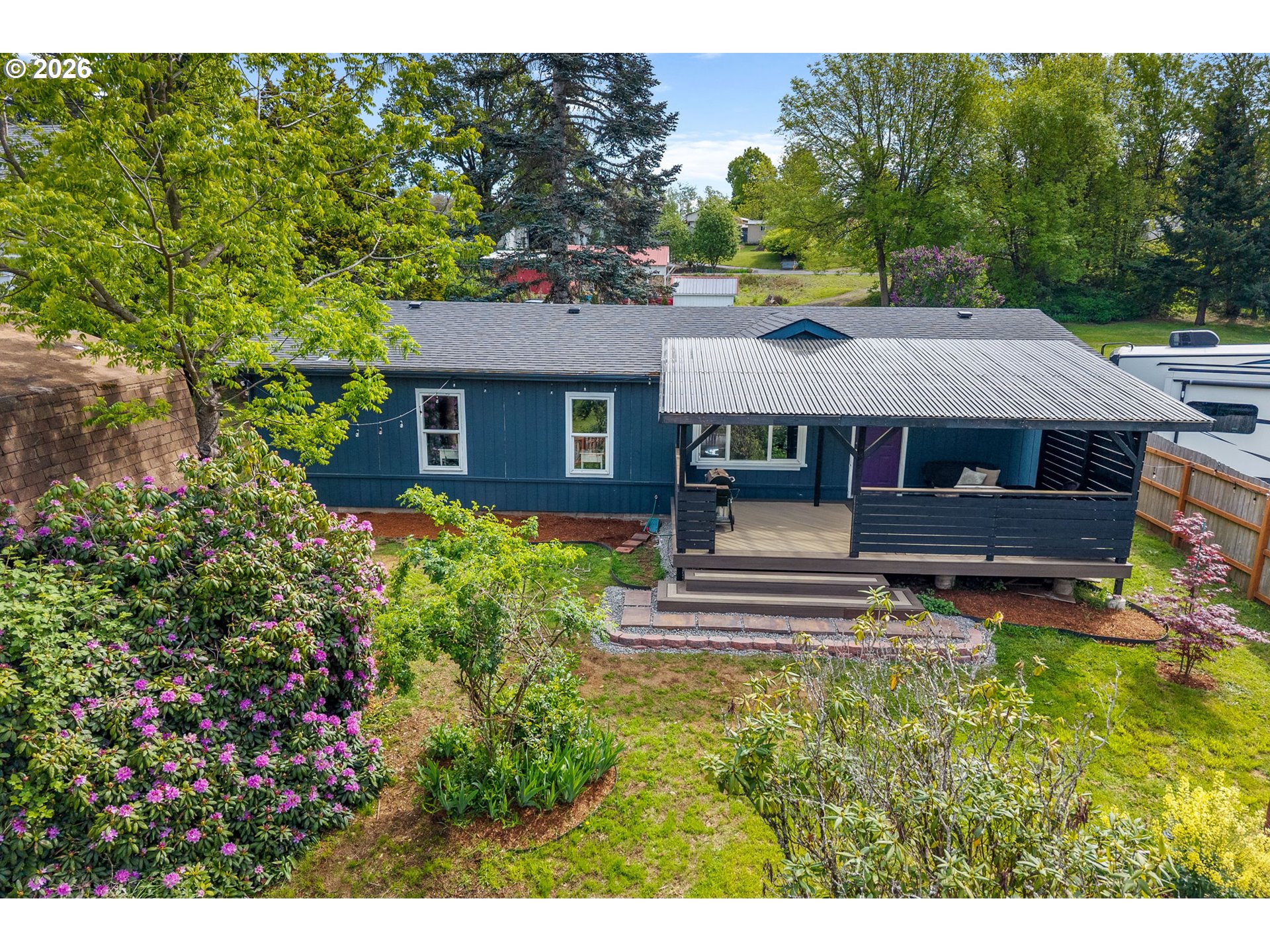 11 2nd Street Carson, WA 98610 - Photo 34 of 40 a front view of a house with a yard table and chairs