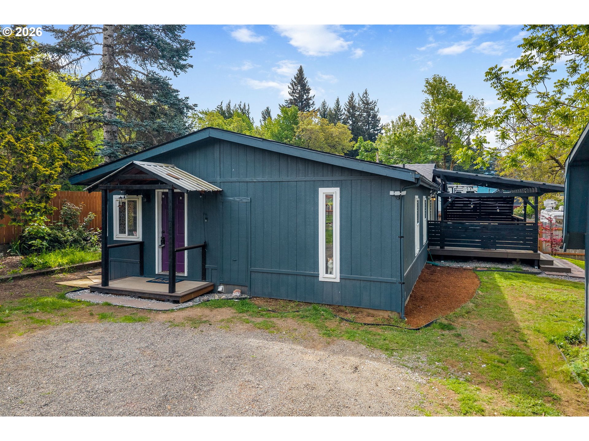 11 2nd Street Carson, WA 98610 - Photo 39 of 40 a backyard of a house with barbeque oven and outdoor seating