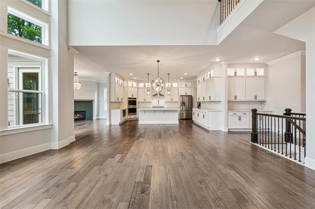 947 Hunter Way Milton, GA 30004 - Photo 27 of 78 a view of a kitchen with wooden floor and windows