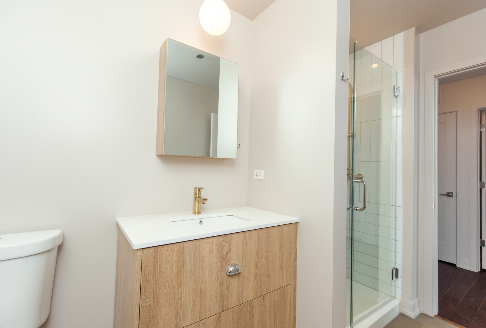 Undisclosed Address Chicago, IL 60613 - Photo 12 of 13 a bathroom with a sink and a mirror