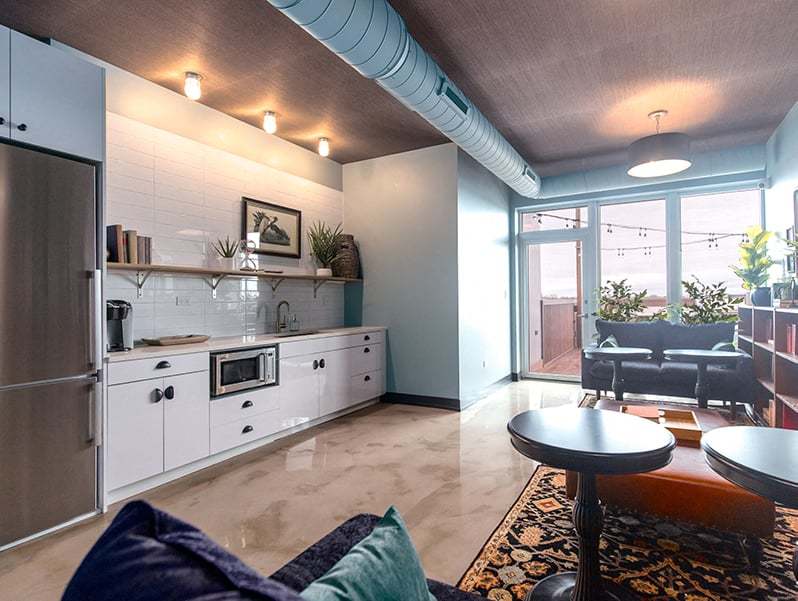 Undisclosed Address Chicago, IL 60613 - Photo 2 of 13 a kitchen with stainless steel appliances kitchen island granite countertop a sink and a refrigerator