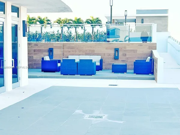 a view of dinning table and chairs in the patio