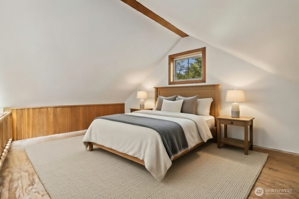 3404 Oysterville Road Oysterville, WA 98641 - Photo 14 of 39 a bed room with a bed and a night stand