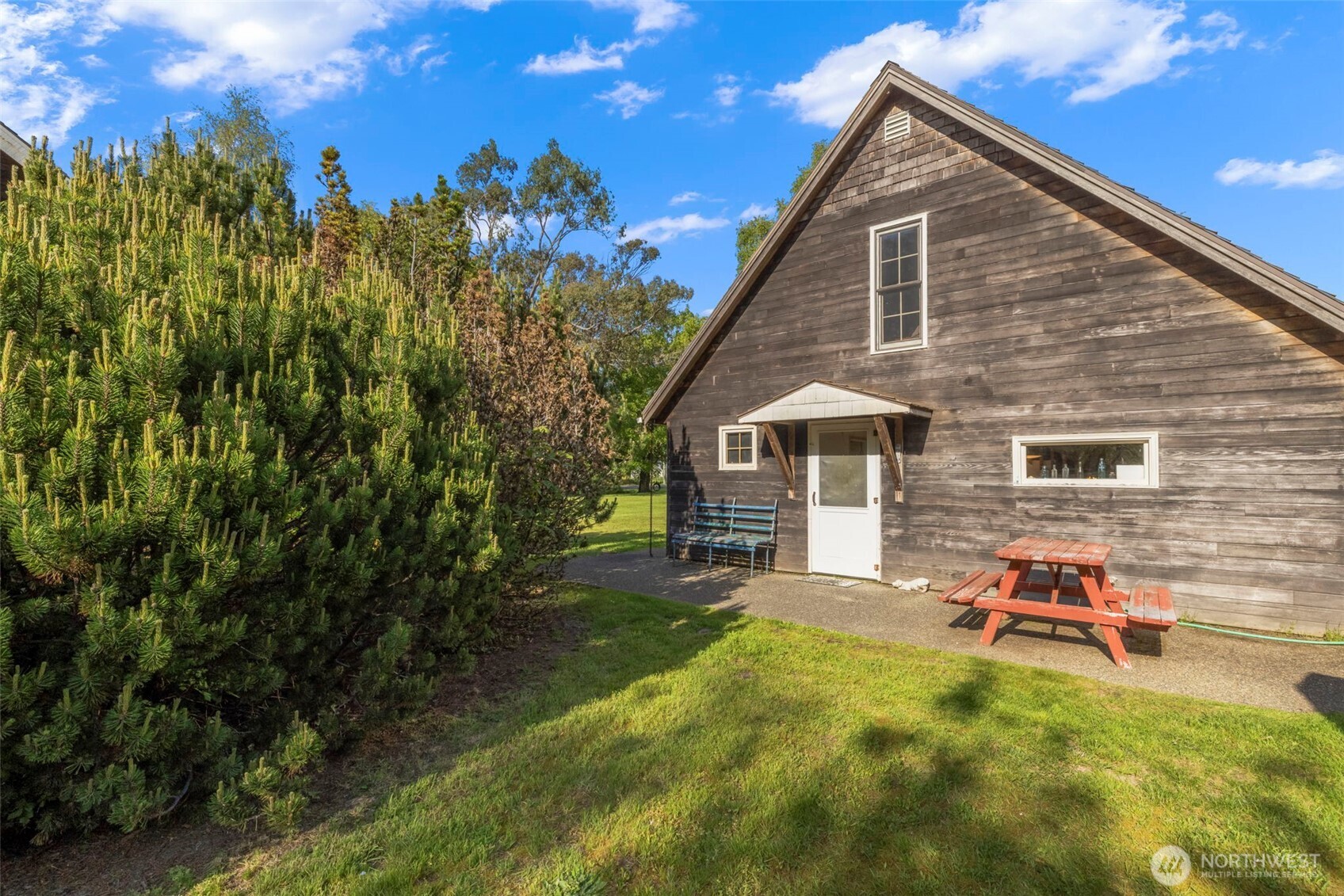 3404 Oysterville Road Oysterville, WA 98641 - Photo 21 of 39 a backyard of a house with table and chairs