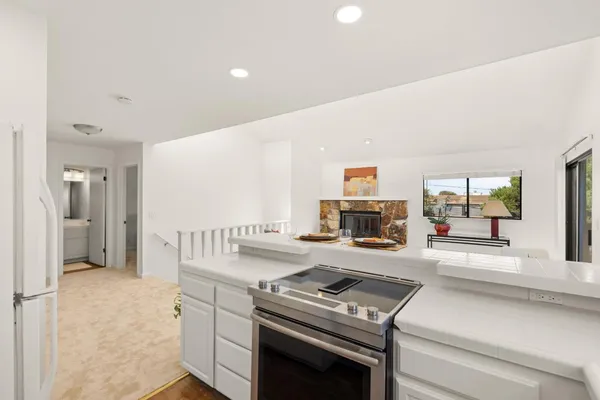 a kitchen that has a stove and a microwave