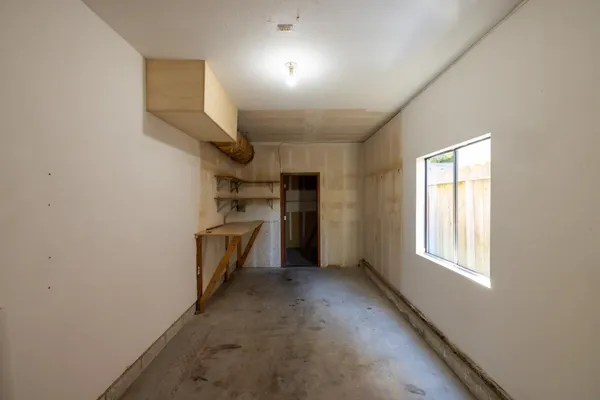 a view of a kitchen with a sink cabinets and a window