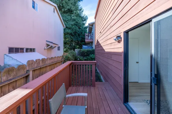 a view of balcony with wooden floor