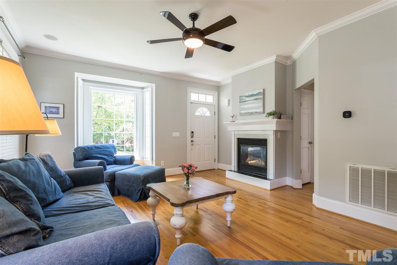 1208 Watauga Street Raleigh, NC 27604 - Photo 2 of 26 a living room with furniture and a fireplace