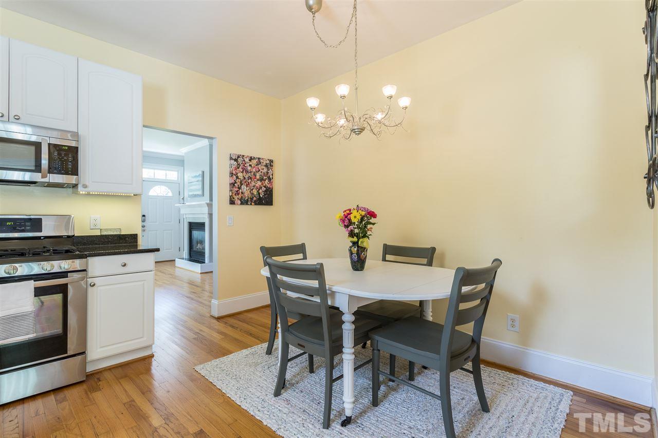1208 Watauga Street Raleigh, NC 27604 - Photo 8 of 26 a view of a dining room with furniture and wooden floor