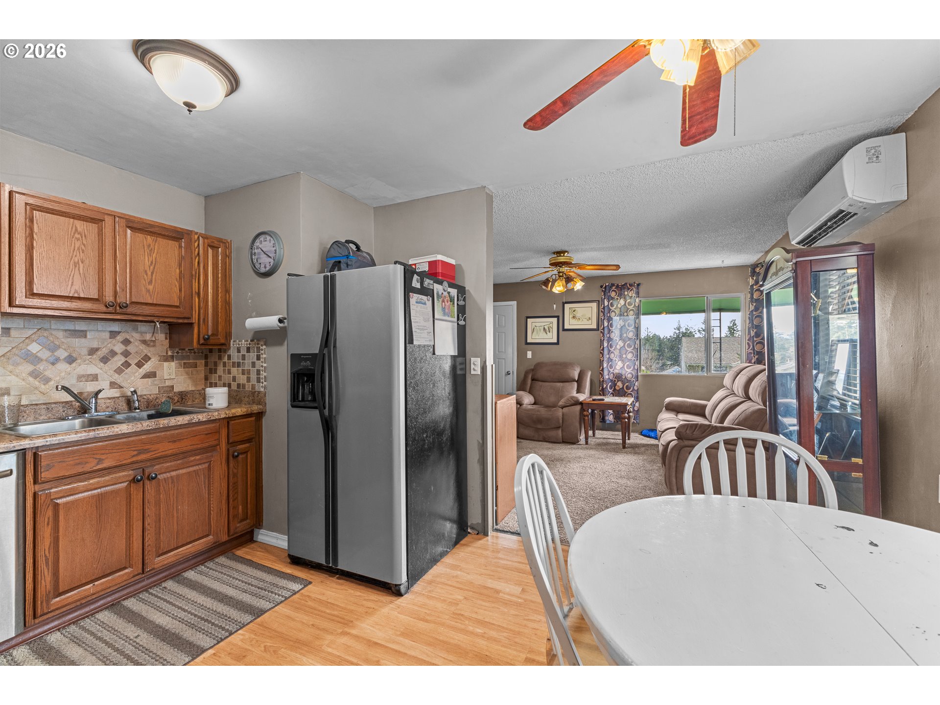 900 West 17th Street Coquille, OR 97423 - Photo 13 of 36 a kitchen with stainless steel appliances granite countertop a refrigerator and a sink