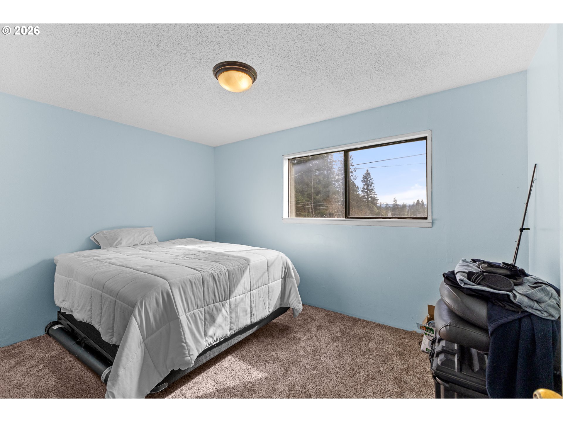 900 West 17th Street Coquille, OR 97423 - Photo 15 of 36 a bedroom with a bed and a desk