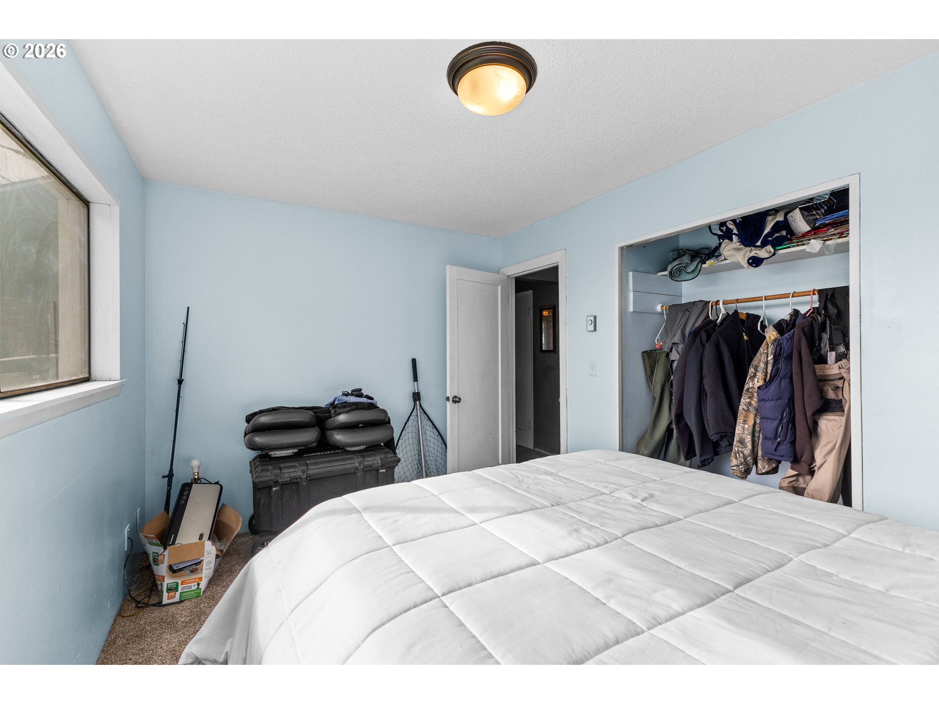 900 West 17th Street Coquille, OR 97423 - Photo 16 of 36 a bedroom with a bed and a closet
