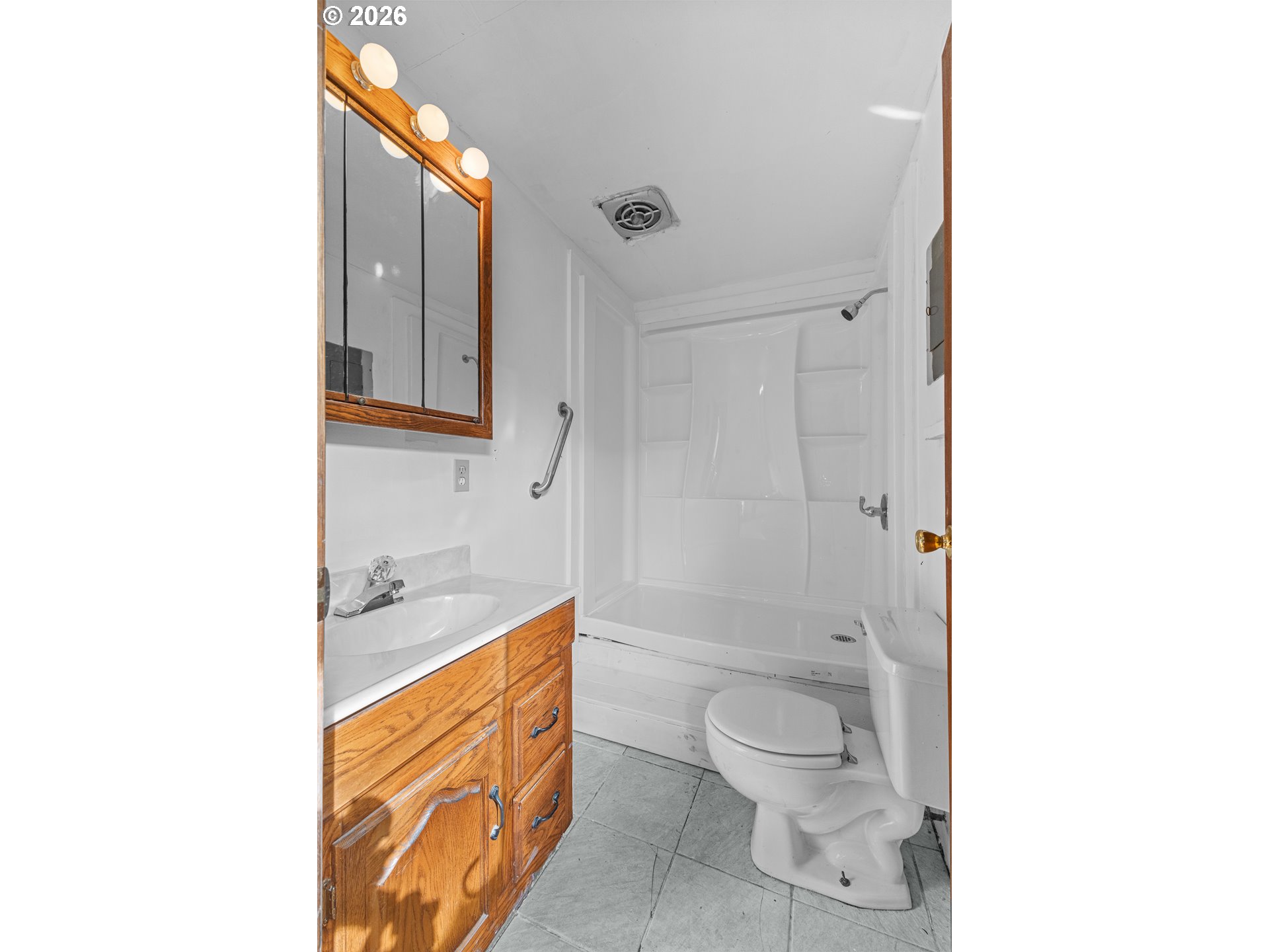 900 West 17th Street Coquille, OR 97423 - Photo 27 of 36 a spacious bathroom with a toilet sink and shower