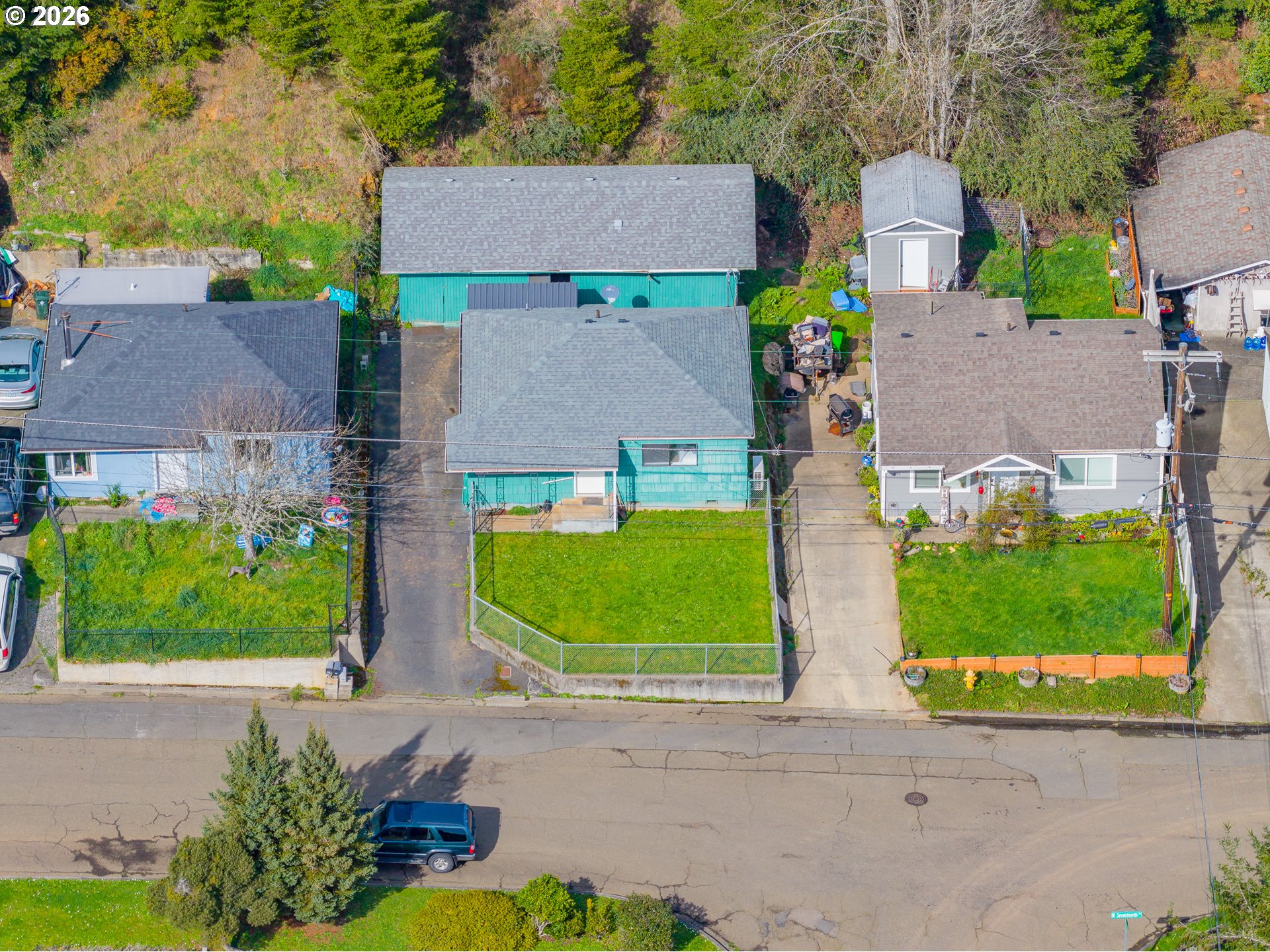 900 West 17th Street Coquille, OR 97423 - Photo 30 of 36 front view of house with a garden and a car parked