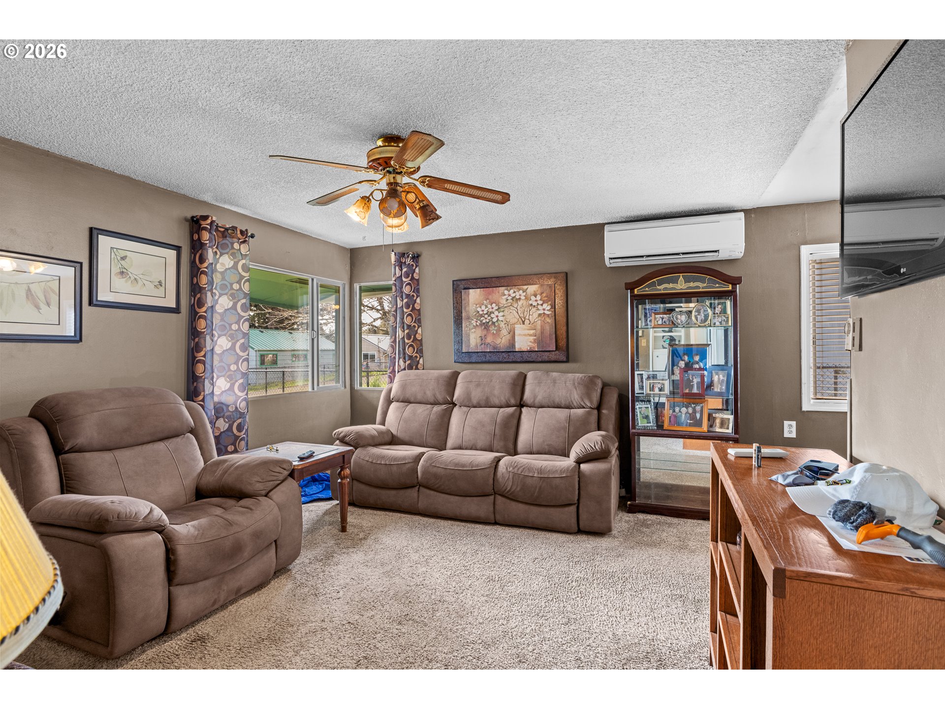 900 West 17th Street Coquille, OR 97423 - Photo 9 of 36 a living room with furniture and a flat screen tv
