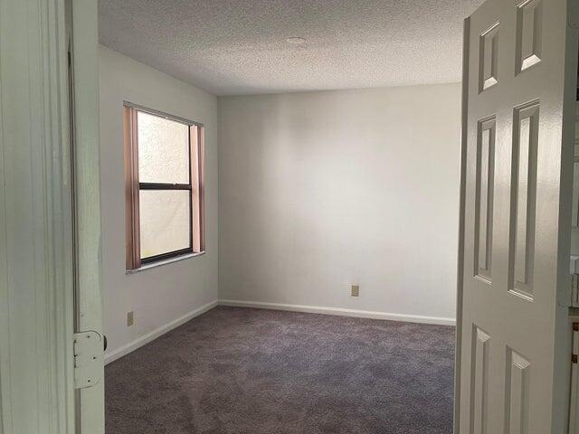12692 Shoreline Drive, Unit 3C Wellington, FL 33414 - Photo 11 of 12 a view of an empty room with a window