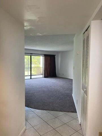 12692 Shoreline Drive, Unit 3C Wellington, FL 33414 - Photo 2 of 12 a view of an empty room with a window