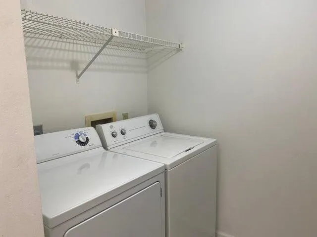 a utility room with dryer and washer
