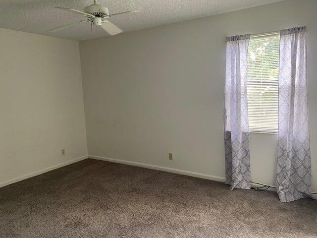 12692 Shoreline Drive, Unit 3C Wellington, FL 33414 - Photo 9 of 12 an empty room with a window
