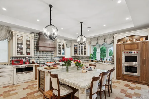 a kitchen with stainless steel appliances granite countertop a stove and cabinets