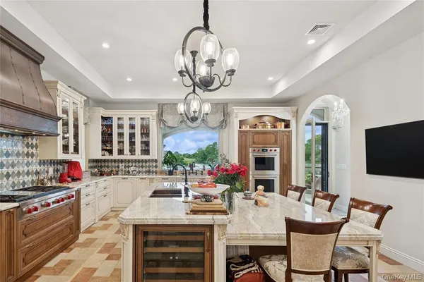 a kitchen with a sink stove and cabinets