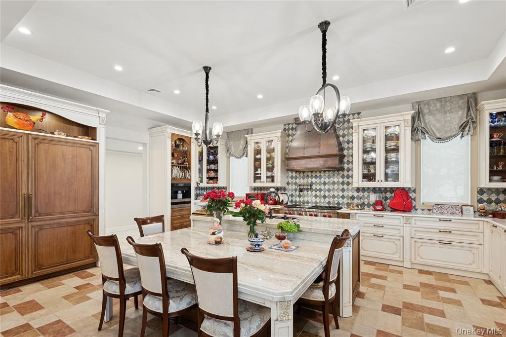 1190 Harbor Road Hewlett Harbor, NY 11557 - Photo 15 of 49 a view of a dining room and chandelier