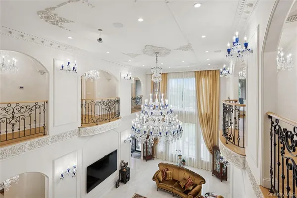 a view of a hallway with a chandelier