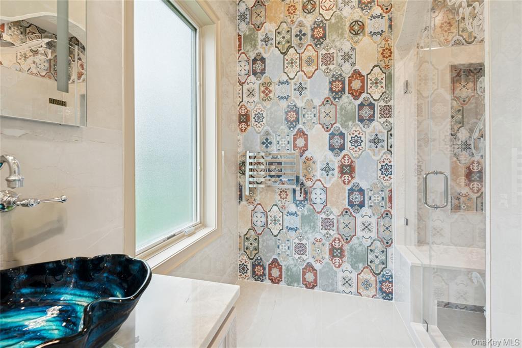 1190 Harbor Road Hewlett Harbor, NY 11557 - Photo 40 of 49 a living room with a bathtub and a shower curtain