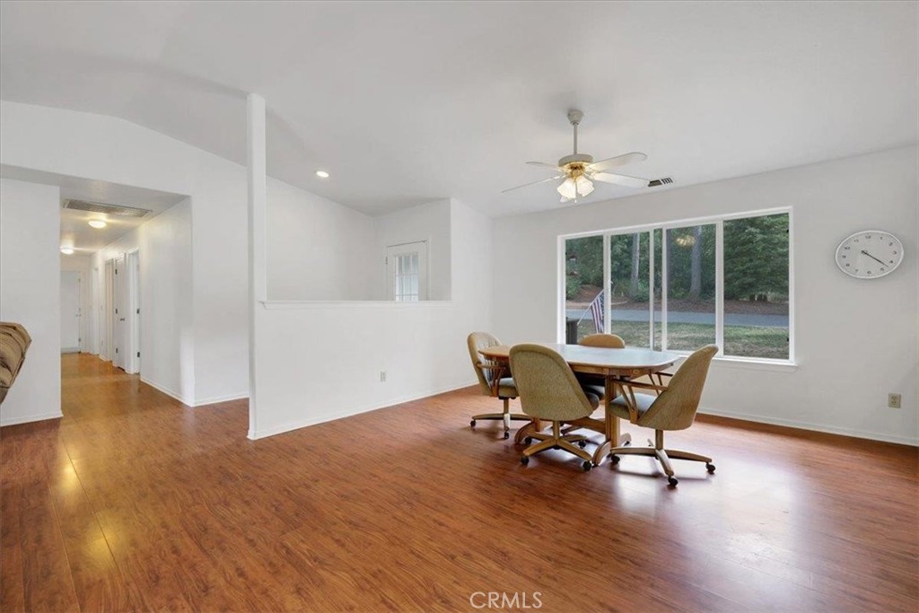 15721 Norcrest Lane Camptonville, CA 95922 - Photo 12 of 43 a dining room with wooden floor and a chandelier