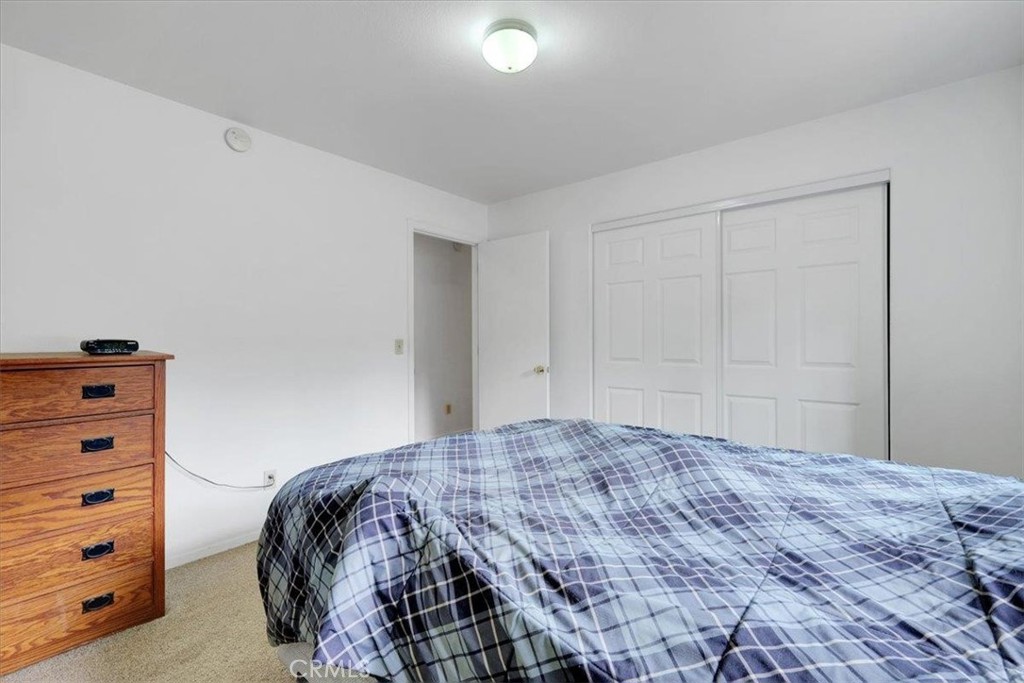 15721 Norcrest Lane Camptonville, CA 95922 - Photo 25 of 43 a bedroom with a bed and a closet