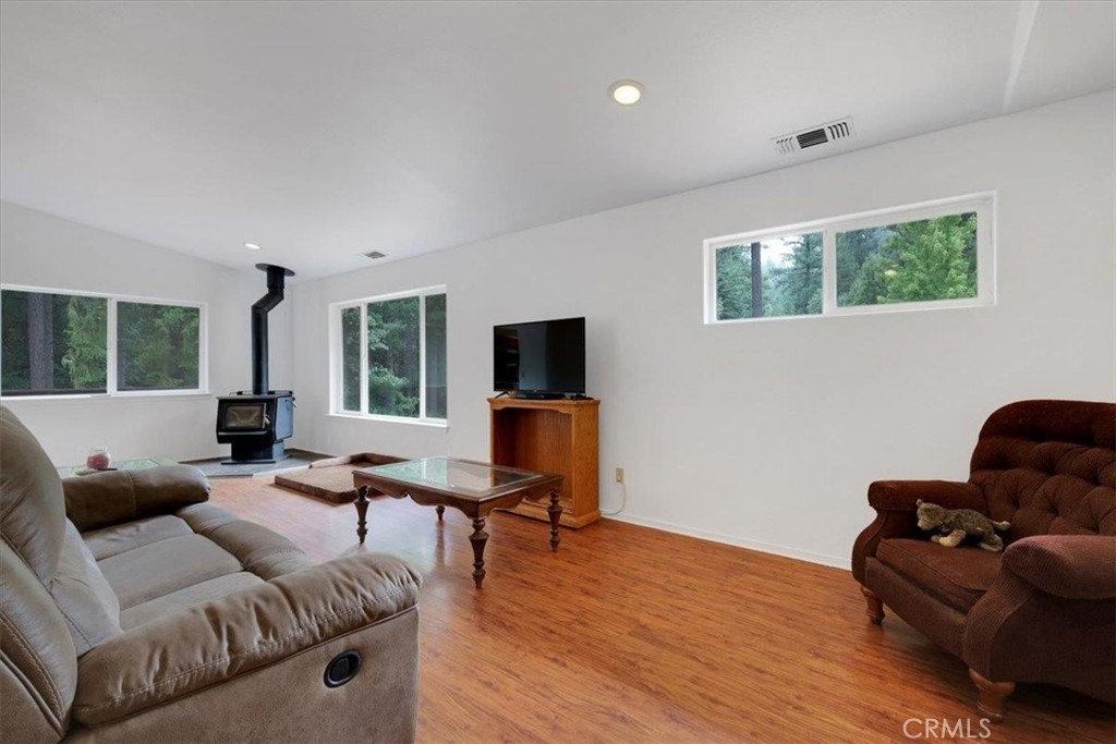 15721 Norcrest Lane Camptonville, CA 95922 - Photo 7 of 43 a living room with furniture and a flat screen tv