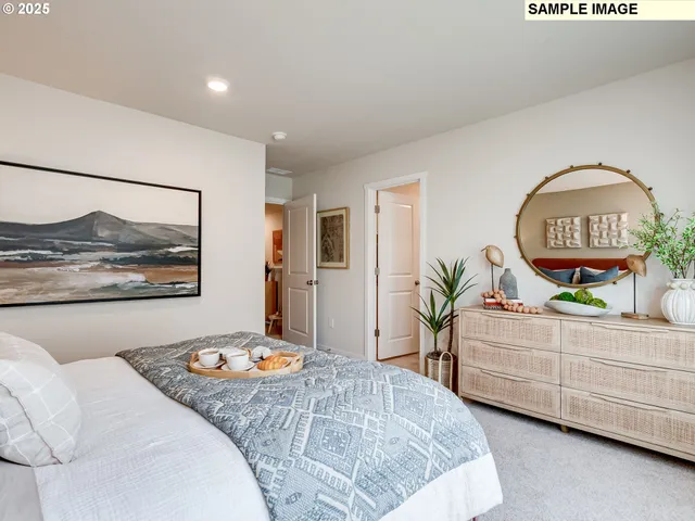 a bedroom with a bed and a dresser