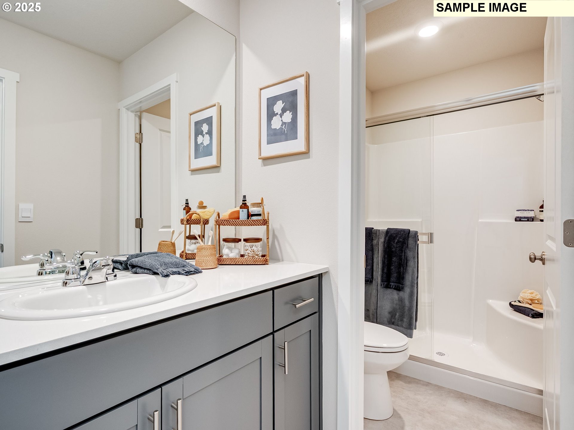 11112 Southeast Maxon Road Vancouver, WA 98664 - Photo 18 of 31 a bathroom with a sink a toilet a shower and a mirror