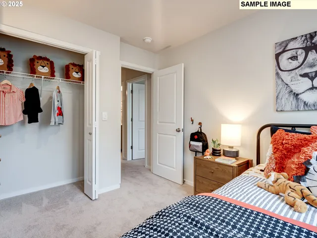 a bedroom with furniture and a lamp