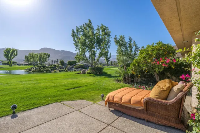 a living room with furniture fireplace and rug