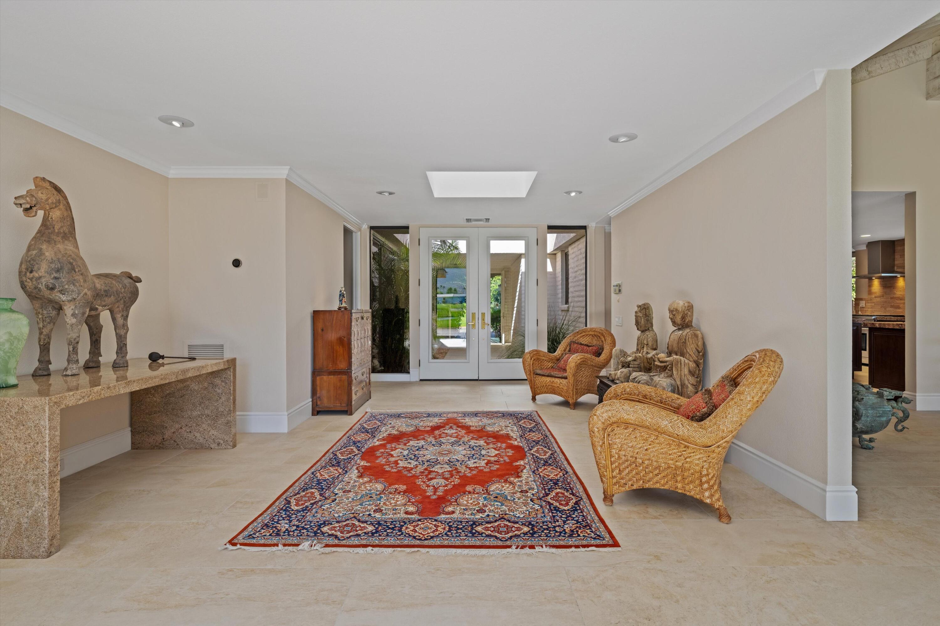 1 Mayfair Drive Rancho Mirage, CA 92270 - Photo 16 of 40 a living room with furniture rug and wooden floor