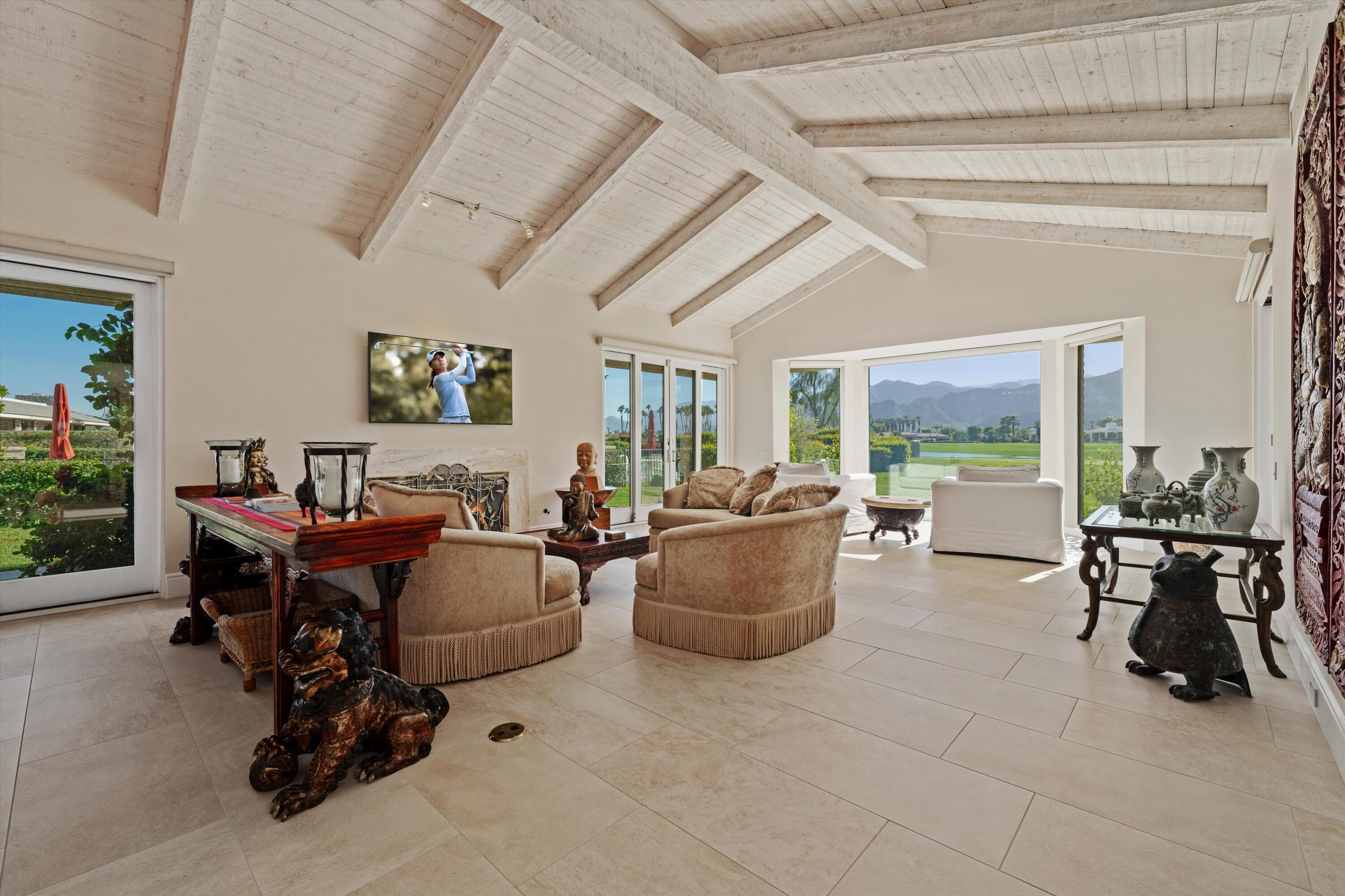1 Mayfair Drive Rancho Mirage, CA 92270 - Photo 17 of 40 a living room with furniture and a large window