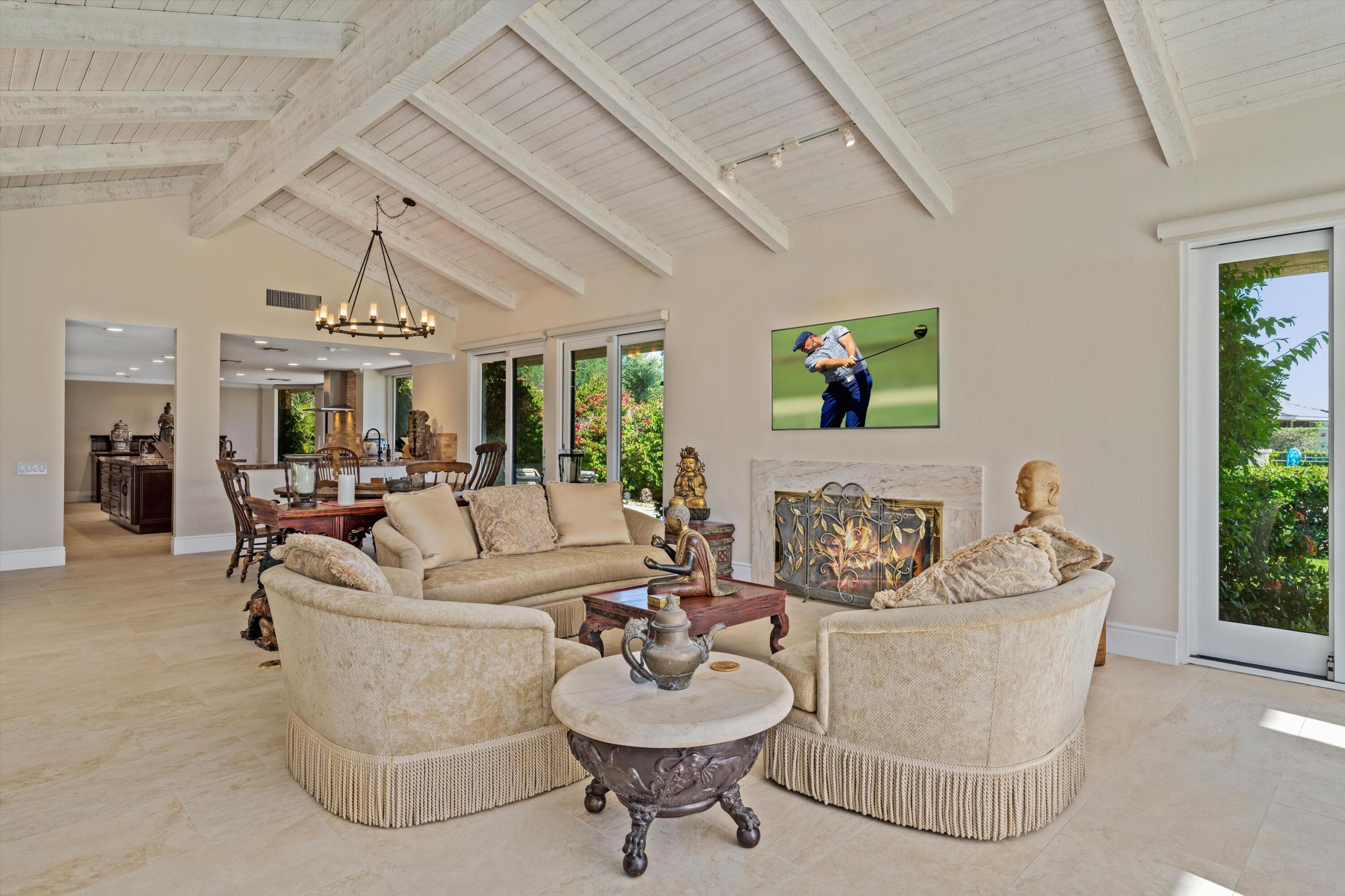 1 Mayfair Drive Rancho Mirage, CA 92270 - Photo 18 of 40 a living room with furniture and a large window