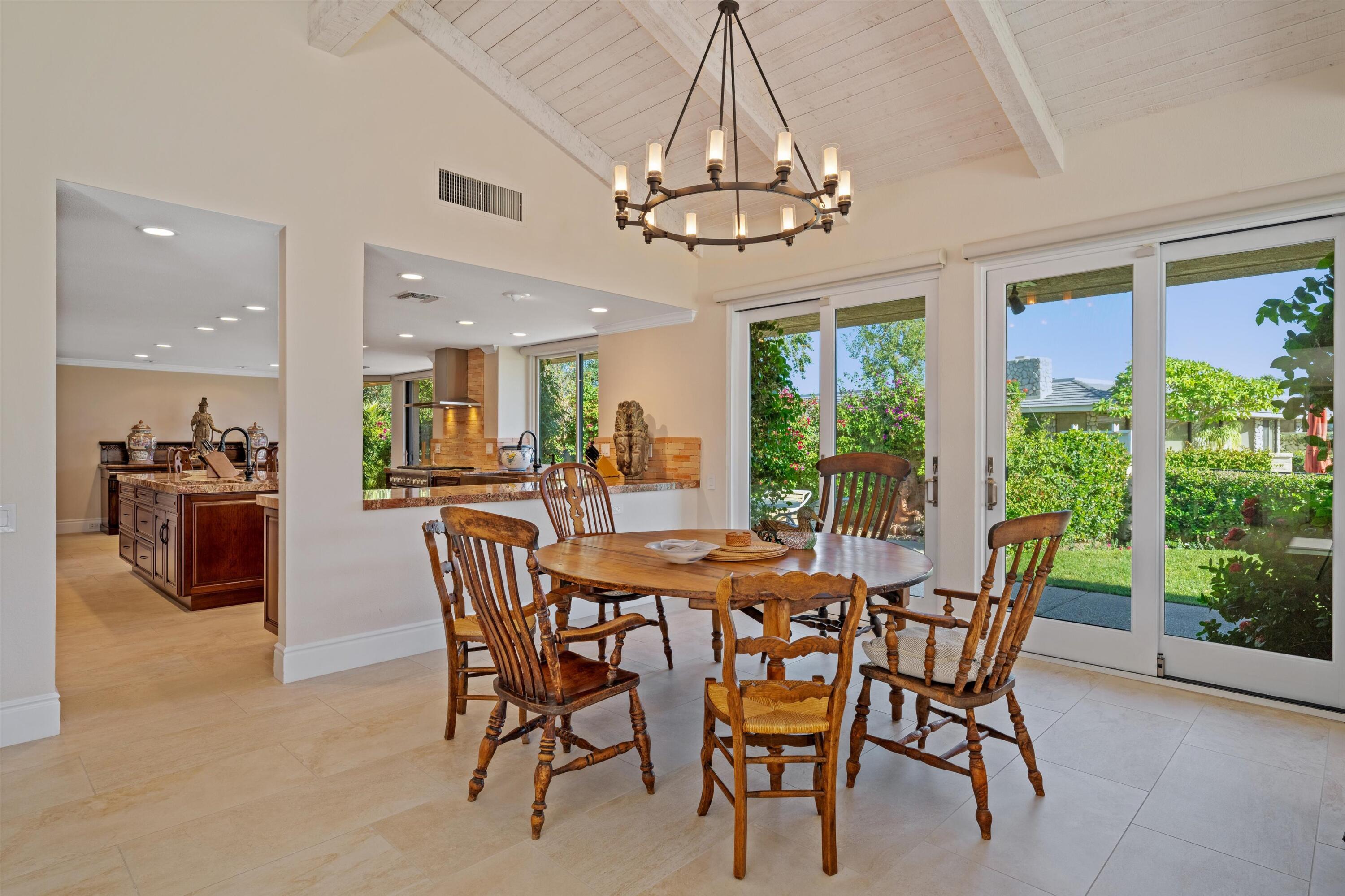 1 Mayfair Drive Rancho Mirage, CA 92270 - Photo 21 of 40 a view of a dining room with furniture window and outside view