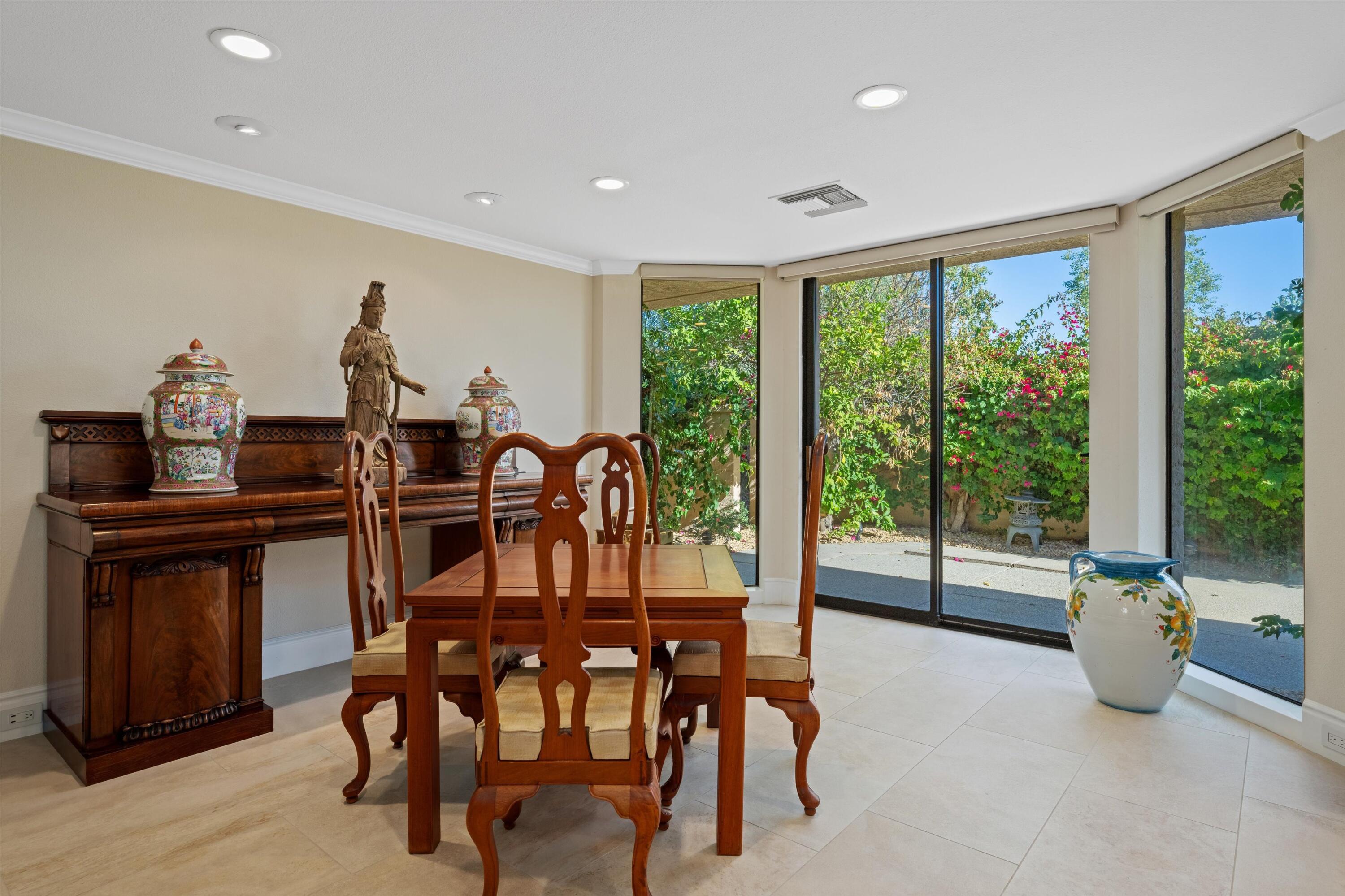 1 Mayfair Drive Rancho Mirage, CA 92270 - Photo 27 of 40 a view of a dining room with furniture window and outside view