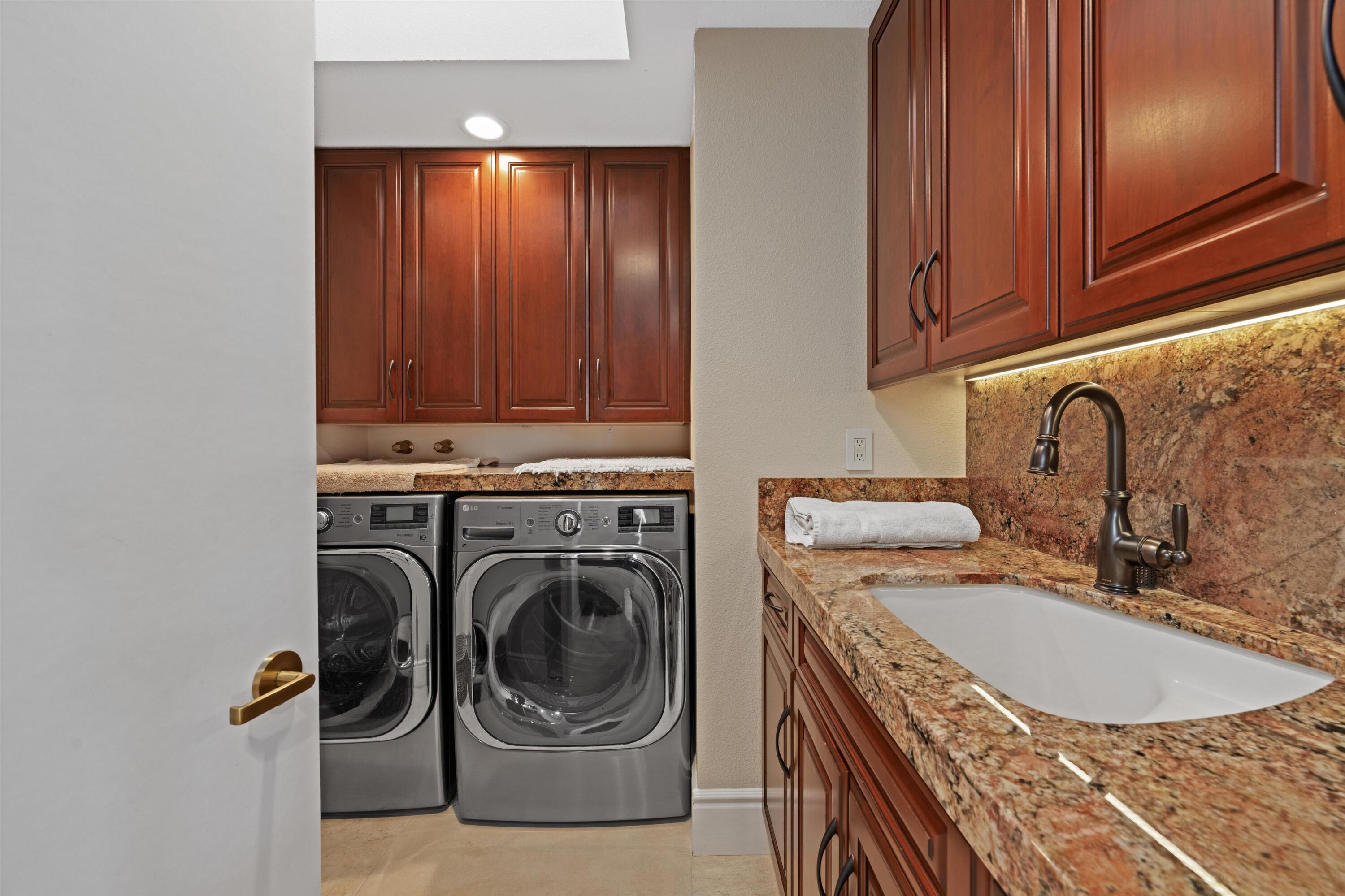 1 Mayfair Drive Rancho Mirage, CA 92270 - Photo 28 of 40 a utility room with sink dryer and washer