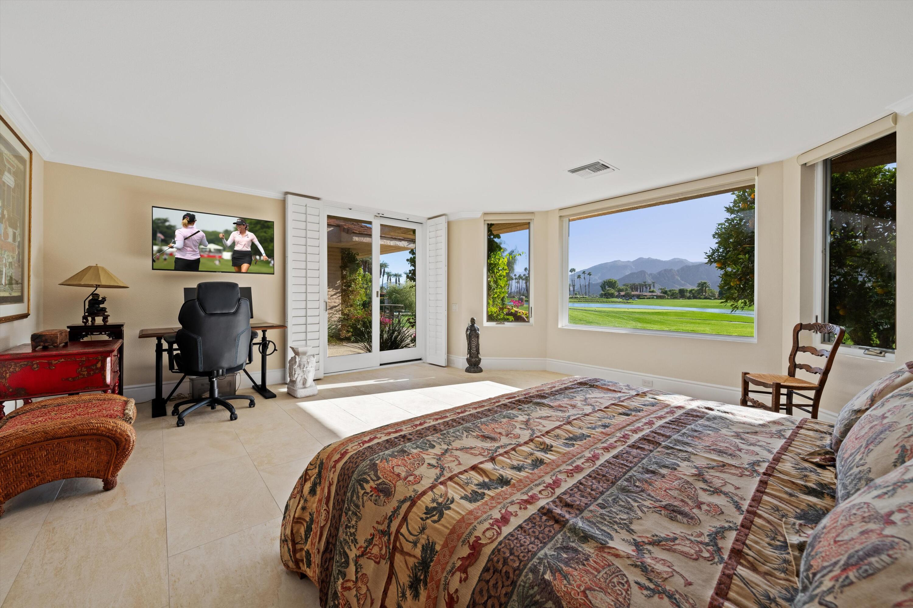 1 Mayfair Drive Rancho Mirage, CA 92270 - Photo 30 of 40 a bedroom with a bed and a large window