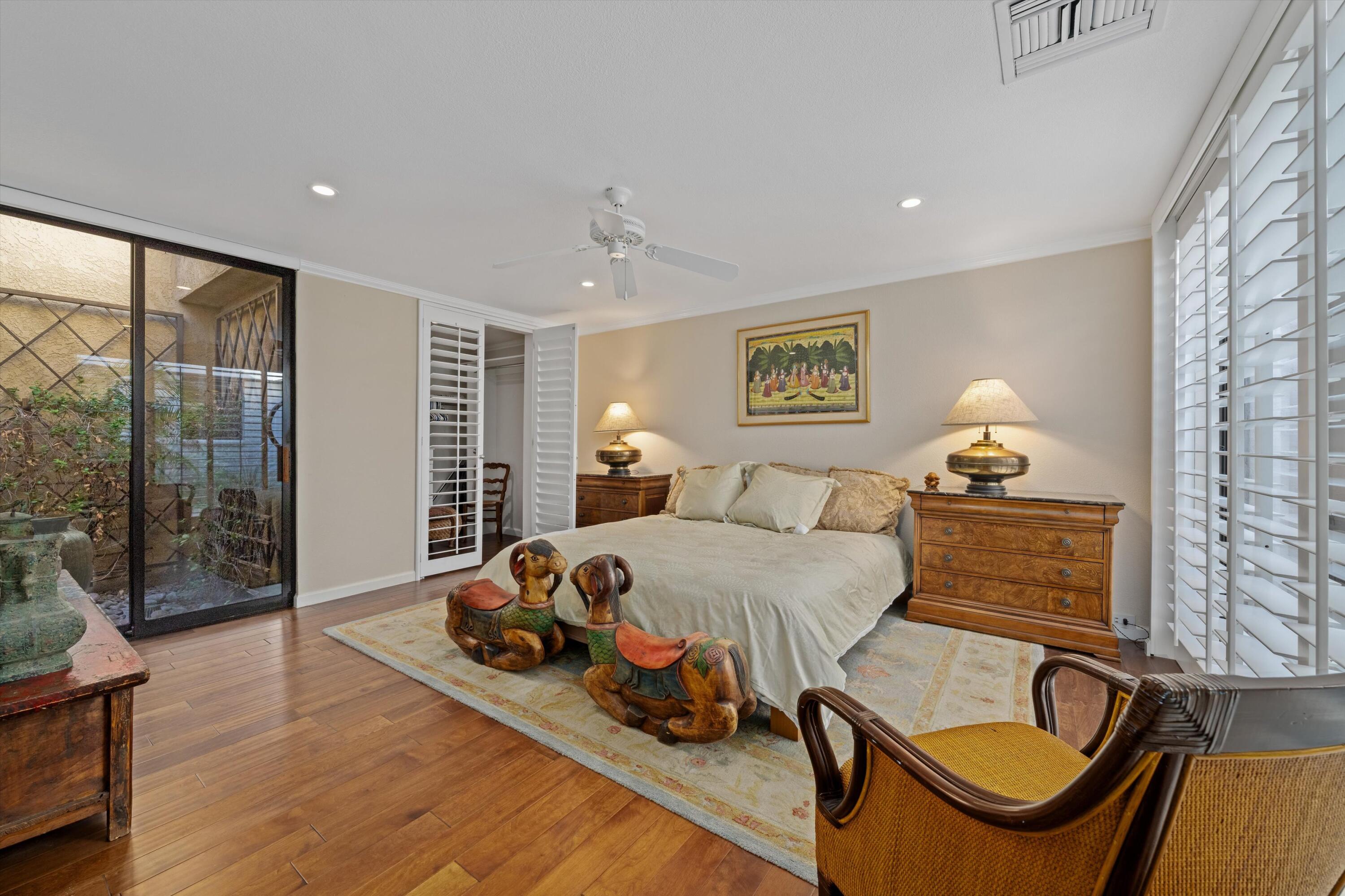 1 Mayfair Drive Rancho Mirage, CA 92270 - Photo 33 of 40 a bedroom with furniture and a window