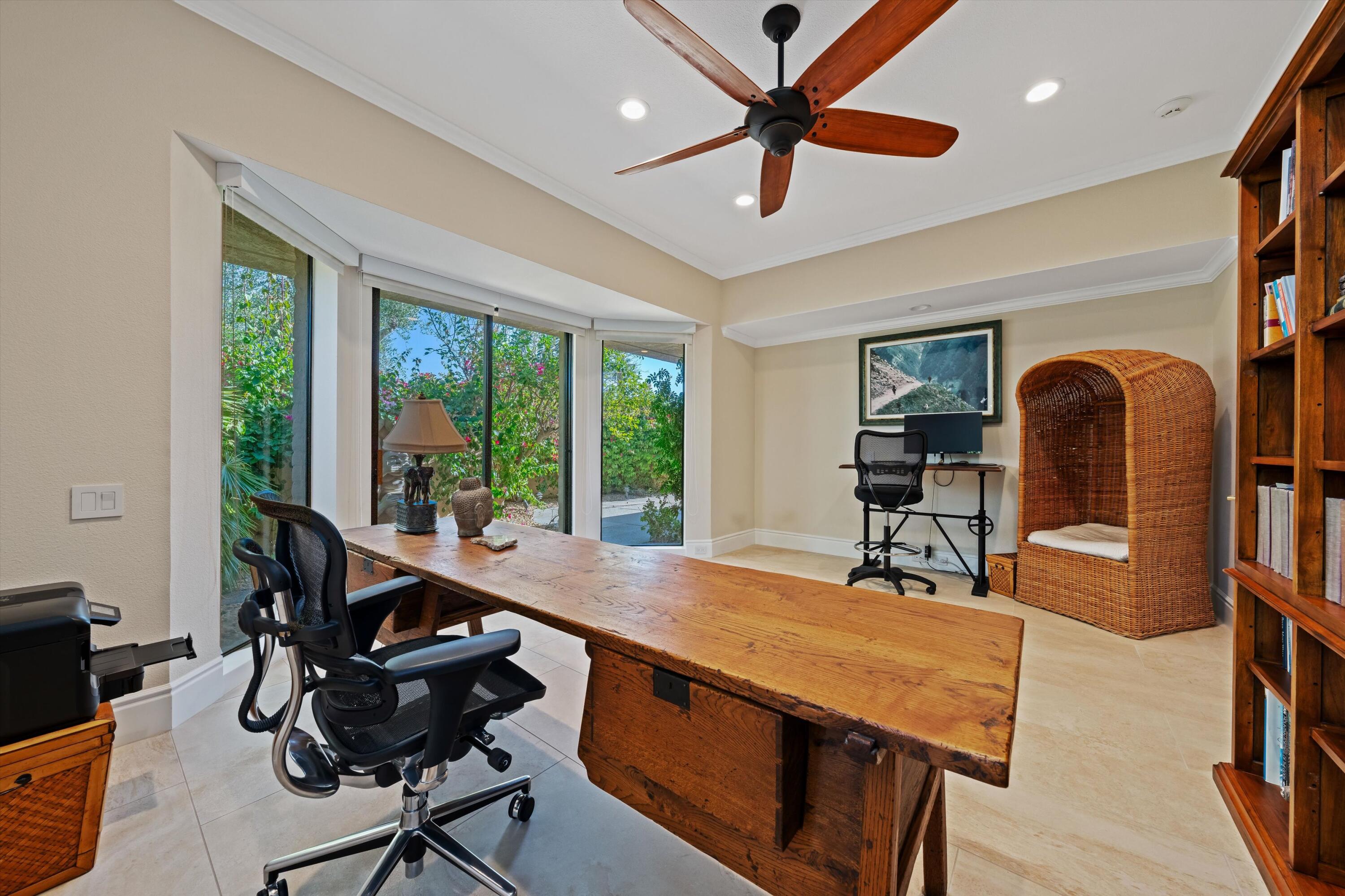 1 Mayfair Drive Rancho Mirage, CA 92270 - Photo 38 of 40 a dining room with furniture a chandelier and wooden floor