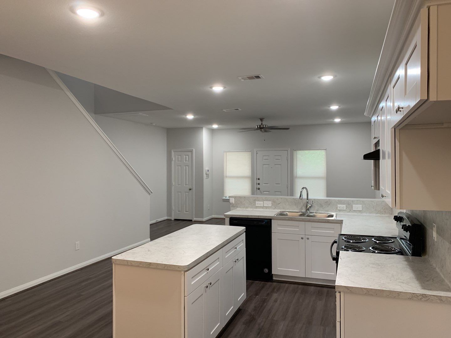 9027 Nyssa Street, Unit A Houston, TX 77078 - Photo 2 of 14 a kitchen with a sink stove and cabinets