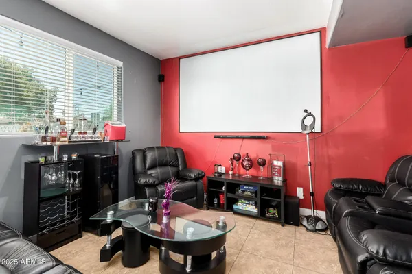 a livingroom with workspace and a couch