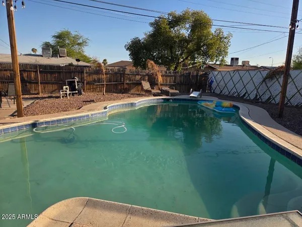 a view of a swimming pool with a patio