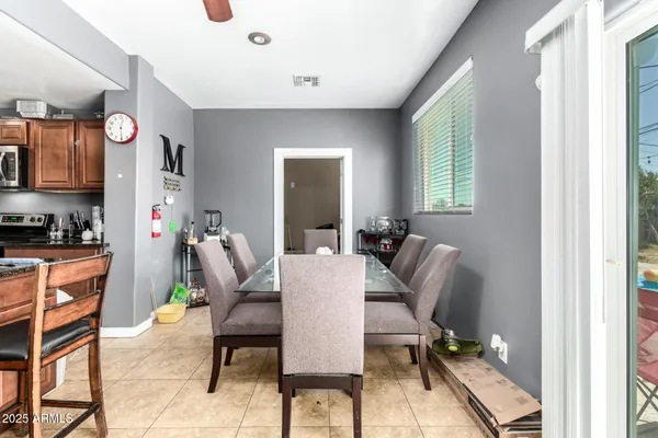 a kitchen with stainless steel appliances kitchen island granite countertop a sink and cabinets