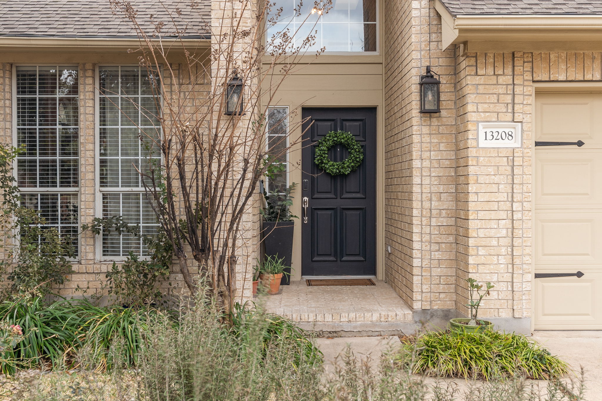13208 Calf Roping Trail Austin, TX 78727 - Photo 2 of 40 This stately two-story brick home sits in the sought-after Scofield Farms neighborhood.
